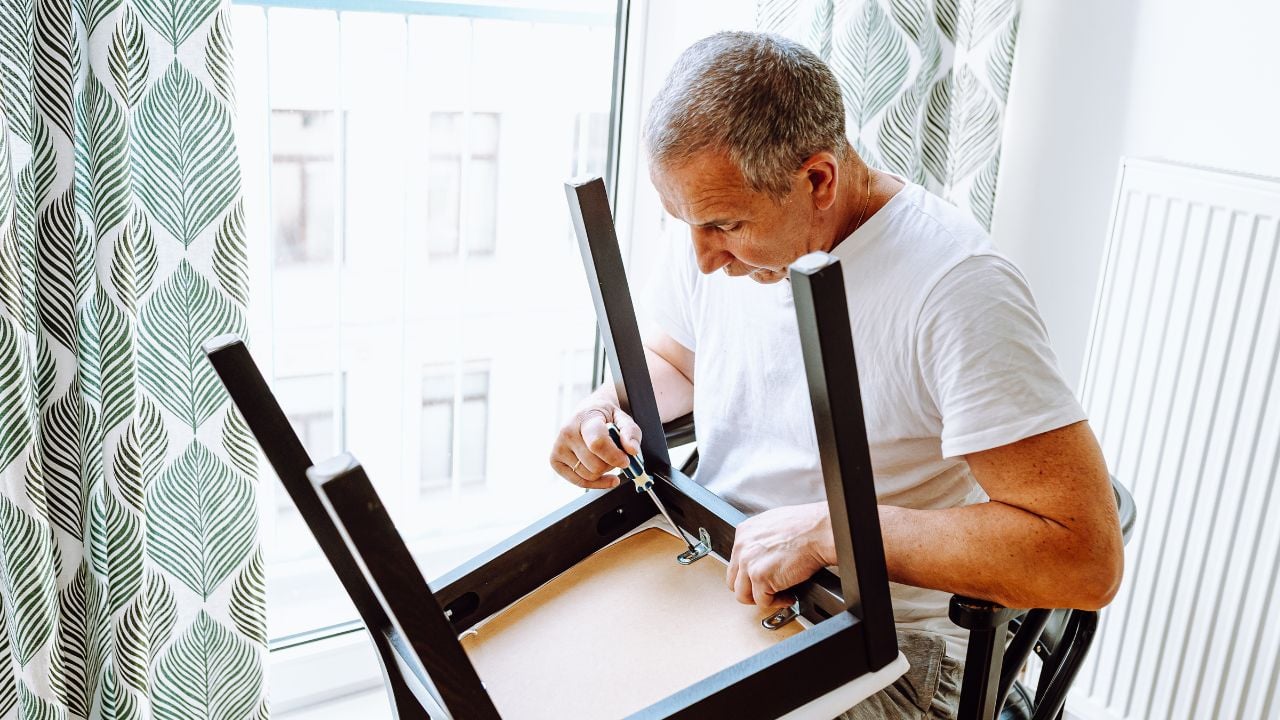 Man fixing furniture