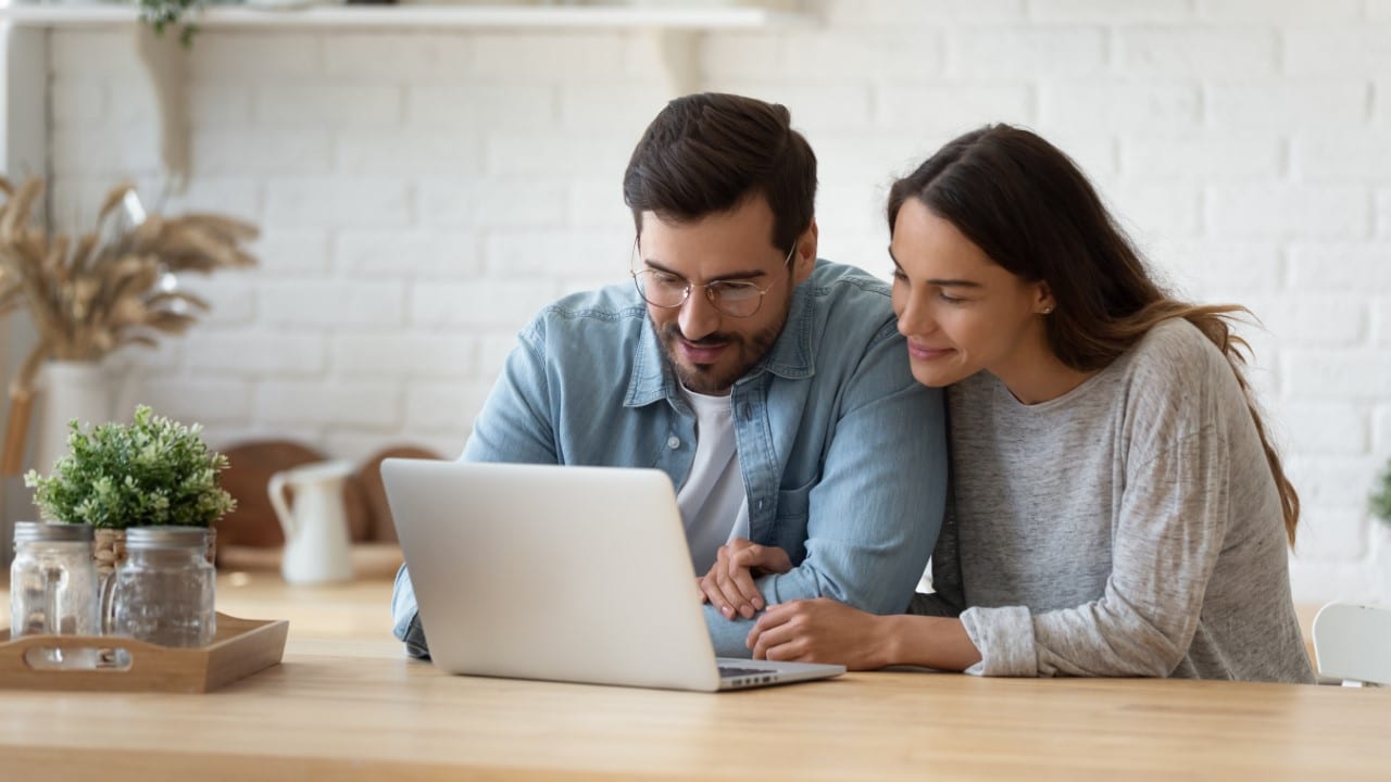 Couple looking at laptop.