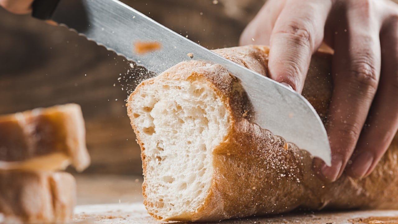 Cutting bread.