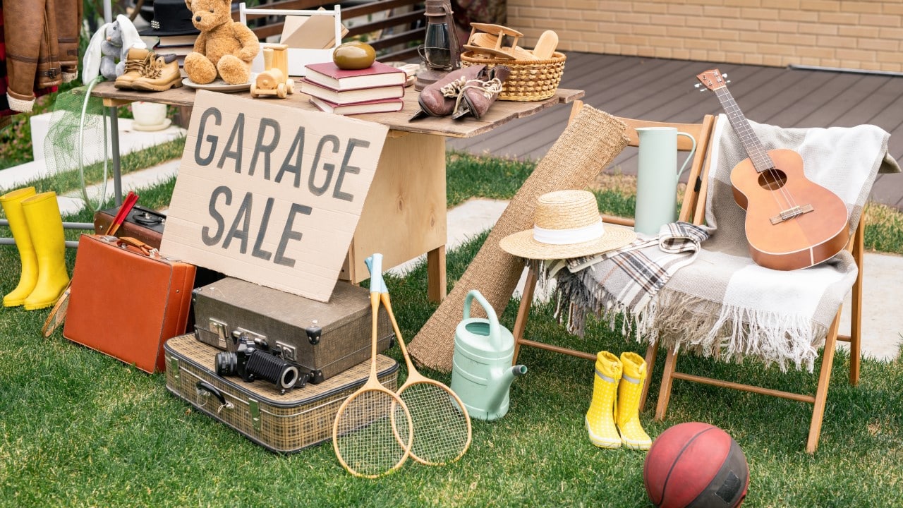 Person selling personal items and belongings at a garage sale
