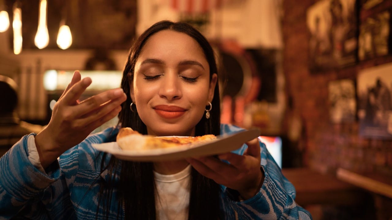 happy tourist breathing in food