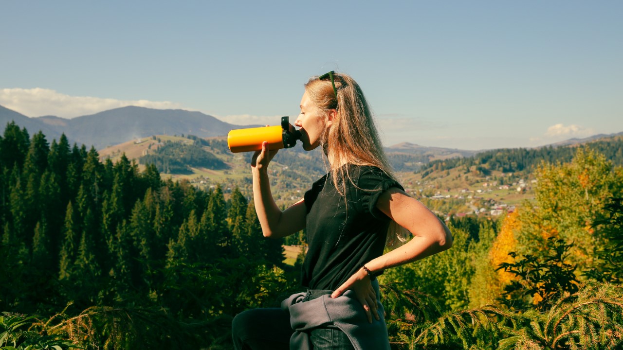 Woman drinking water bottle