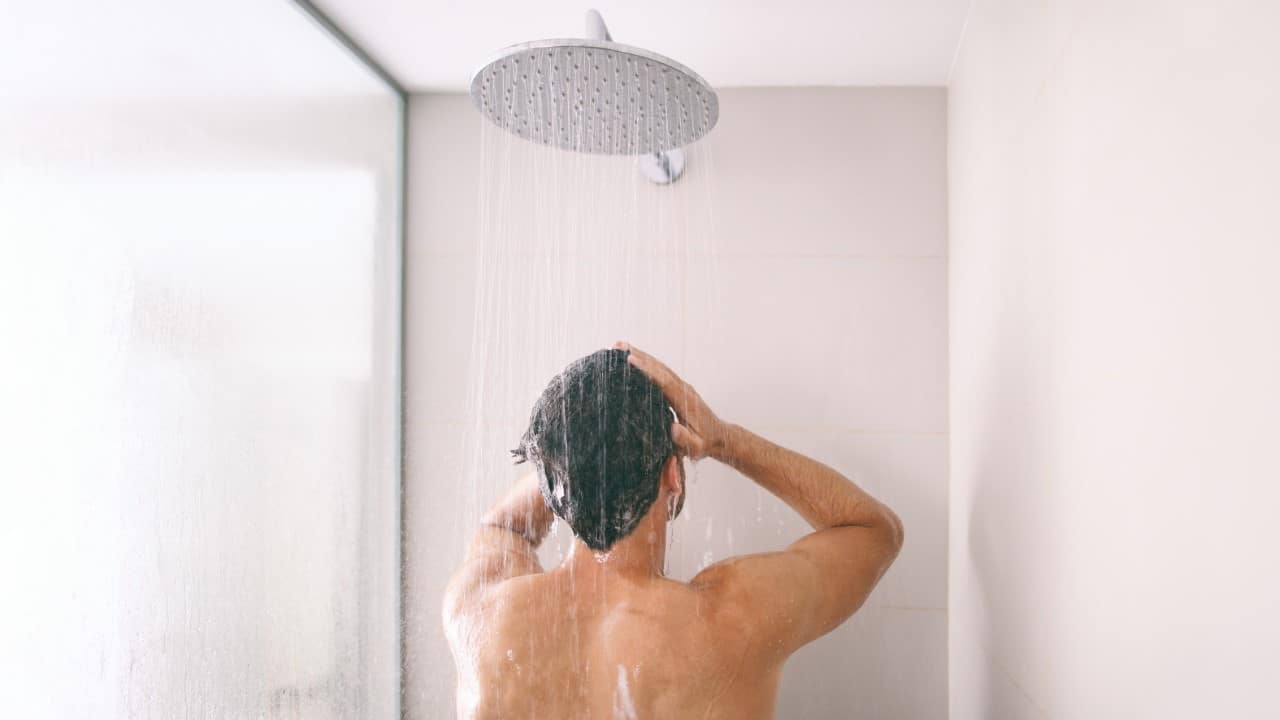 Man taking a shower.