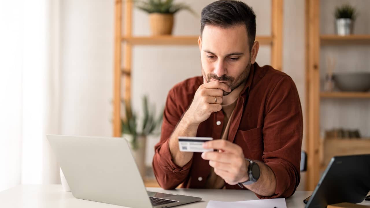 man looking at credit credit