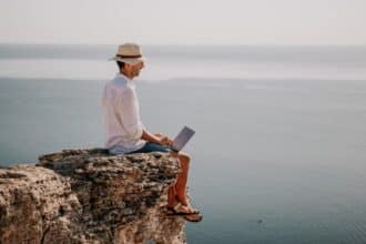 man working on the edge of cliff