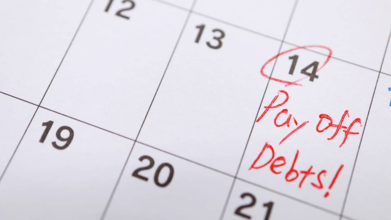 Calendar showing payoff debt date, circled date to target