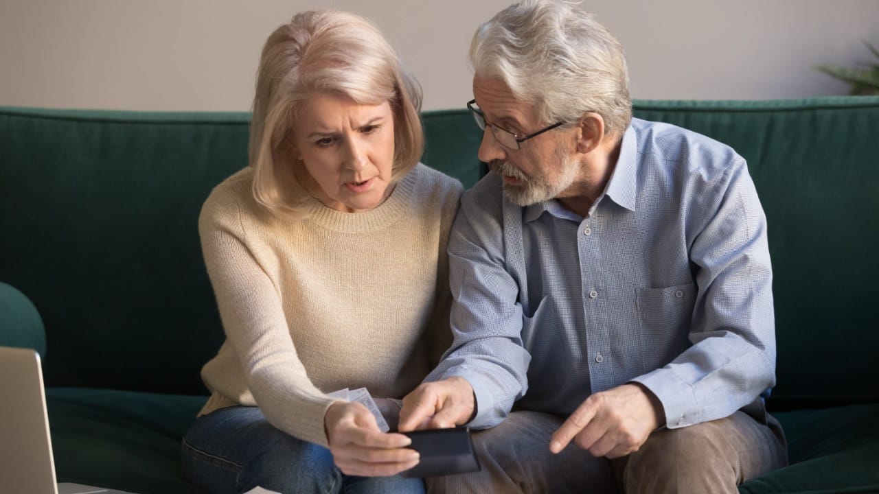 Senior citizens discussing paperwork