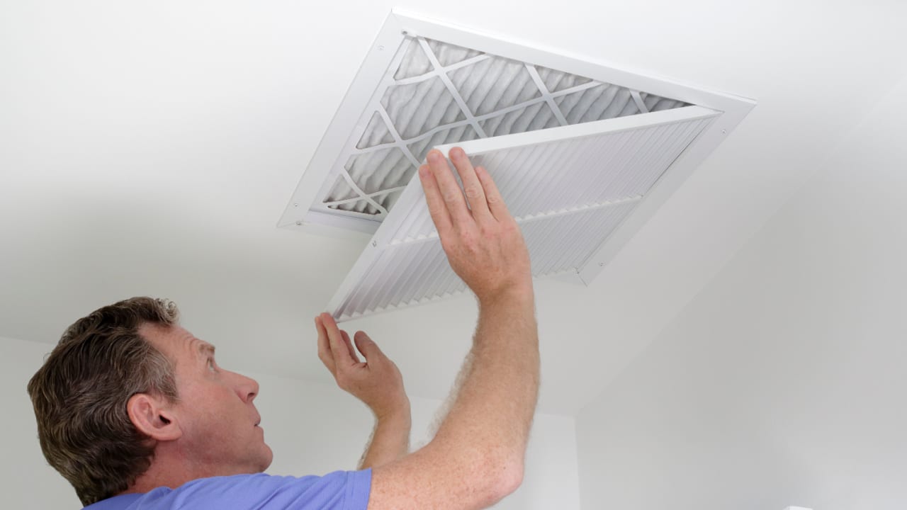 Man changing HVAC filters