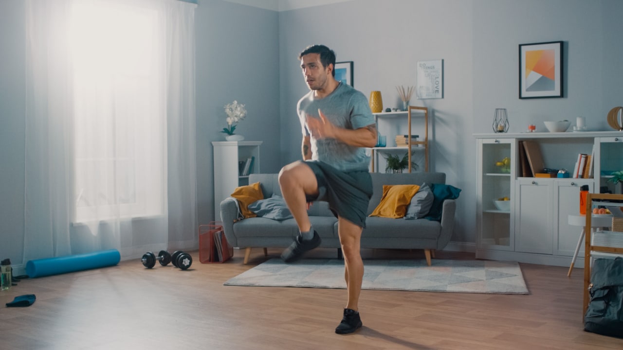 Man exercising in his home