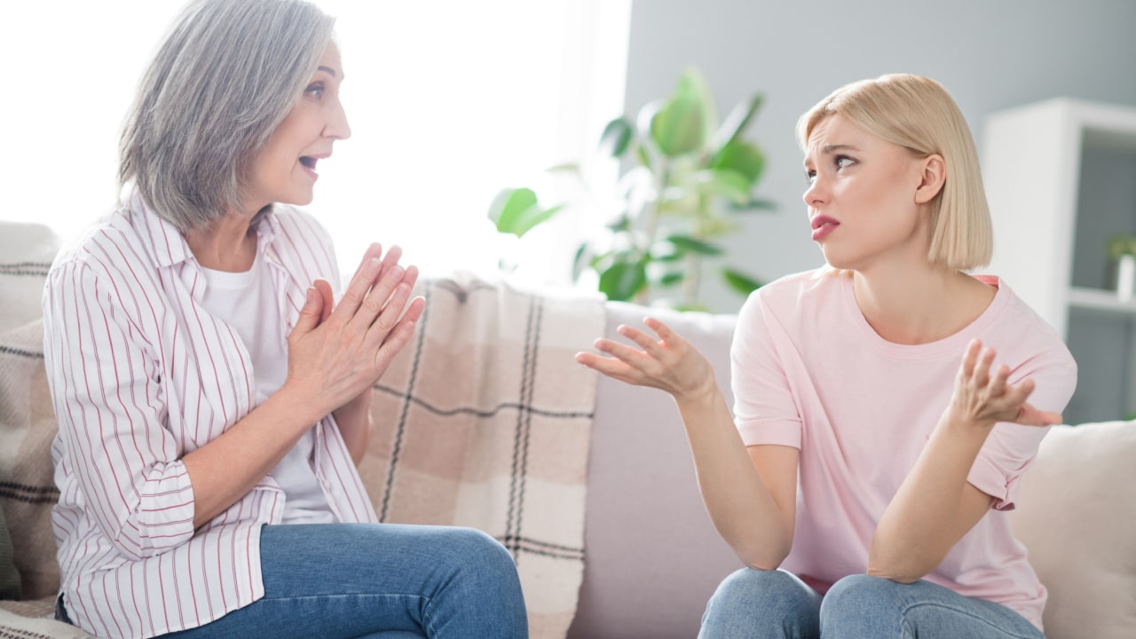 Two women conversing.