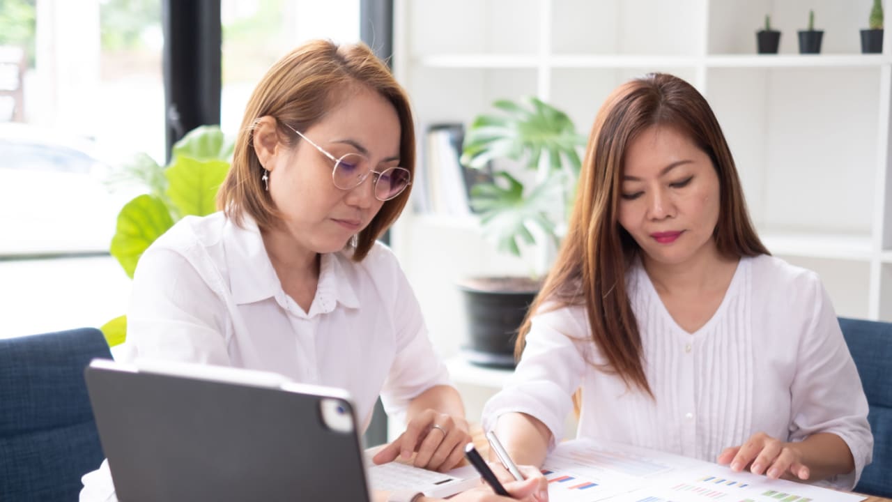 Two women co-signing a loan