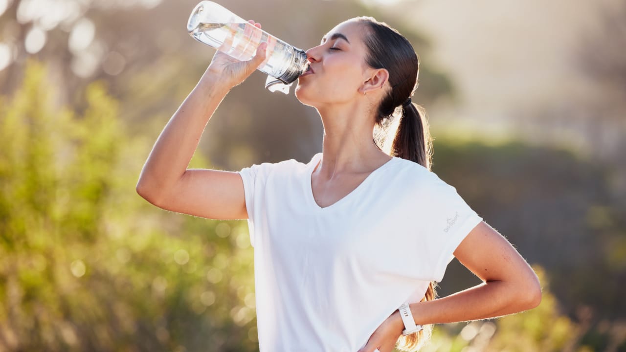 Young woman drinking water