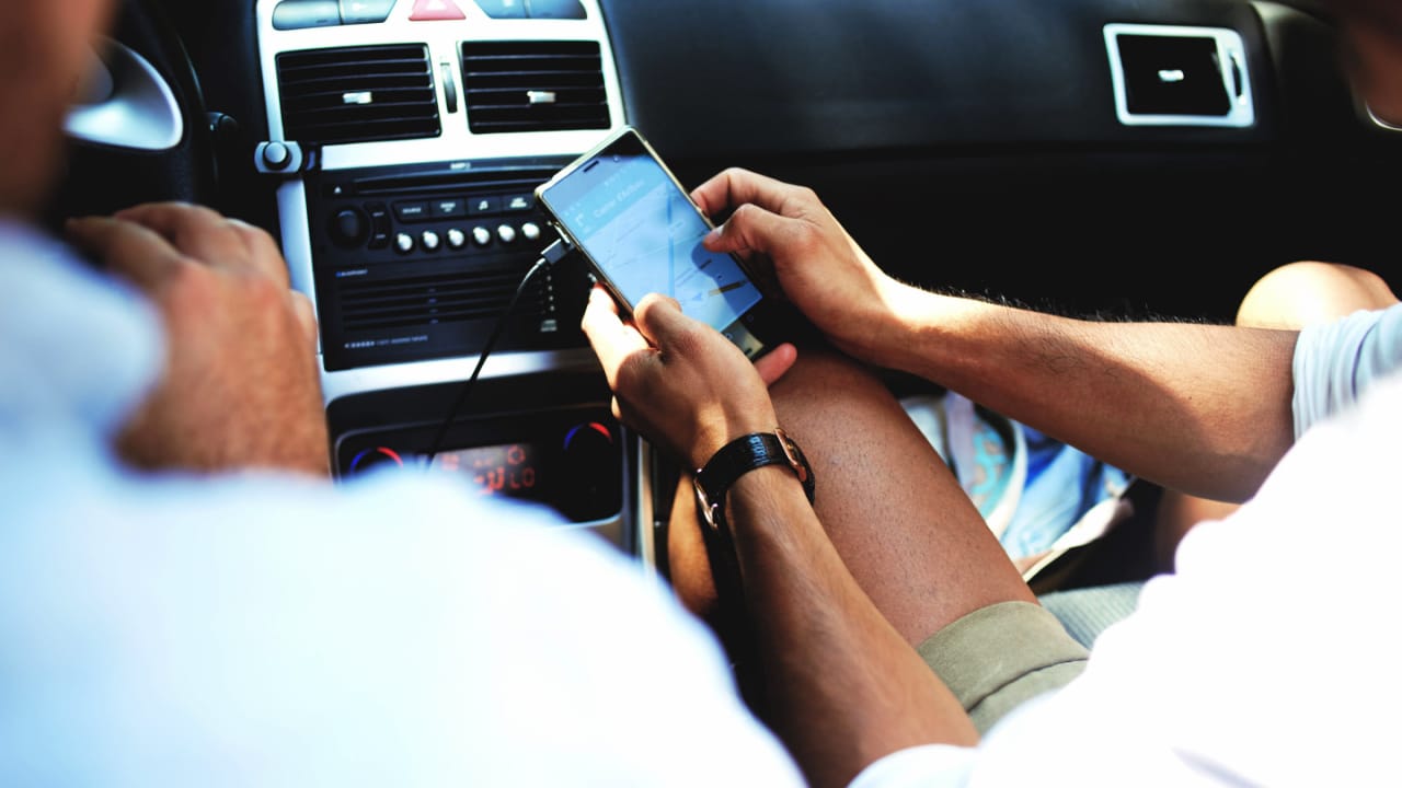 image showing person Using GPS in car