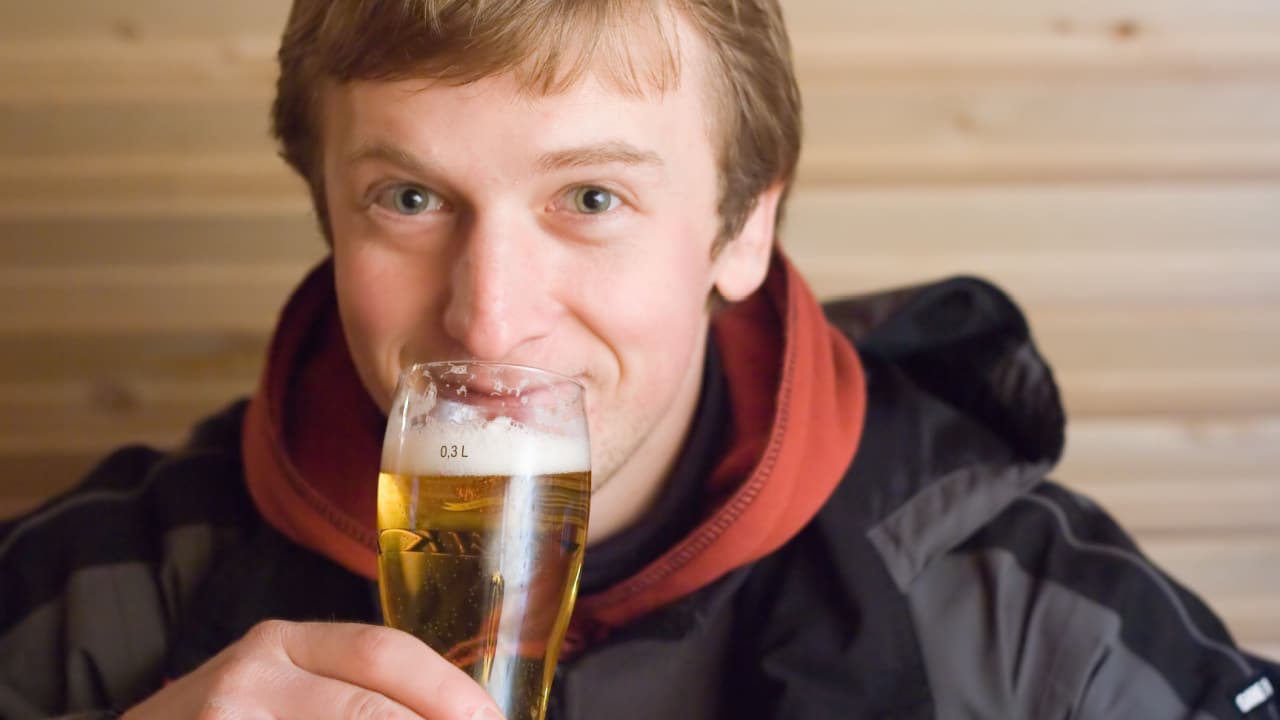 Man drinking a beer.