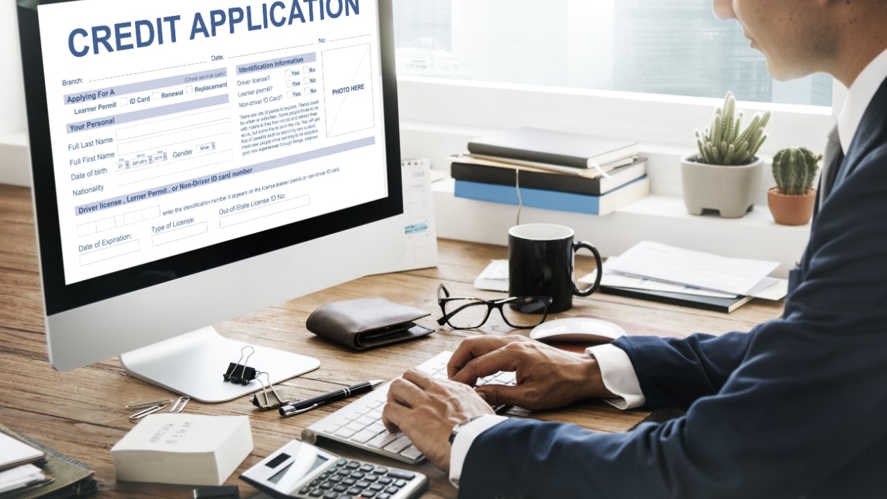 Man completing credit application