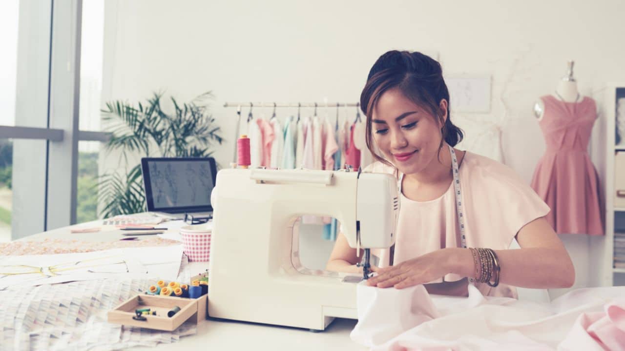Woman sewing, tailoring