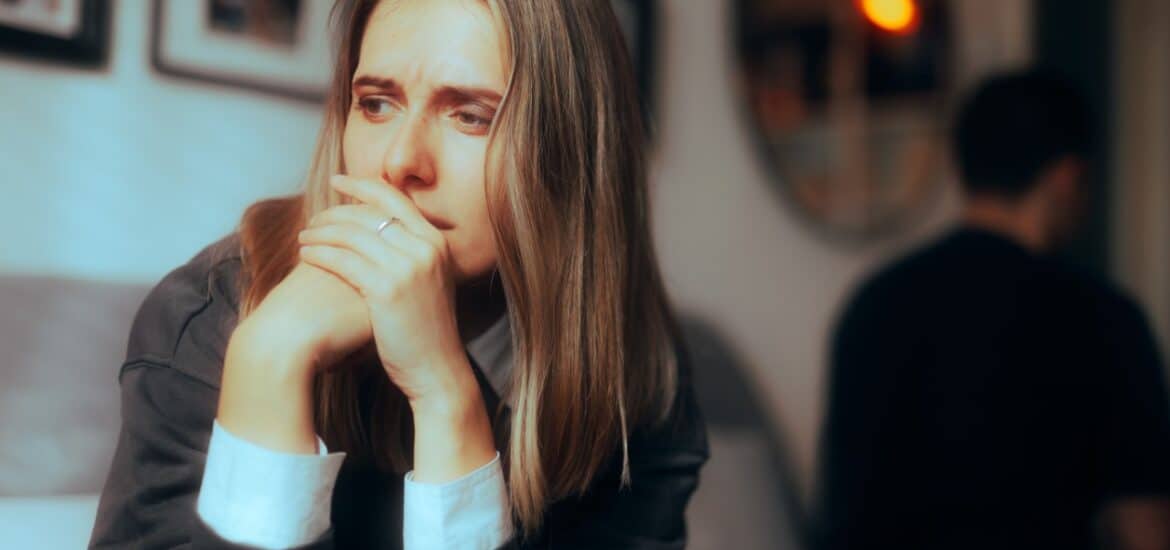 Woman sitting alone sad