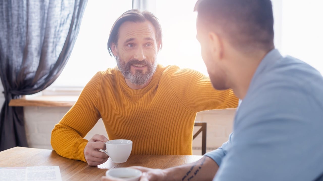 two men talking father and son