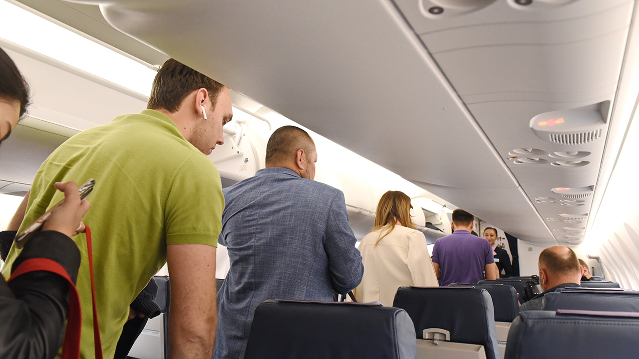 Passengers waiting to sit on airplane