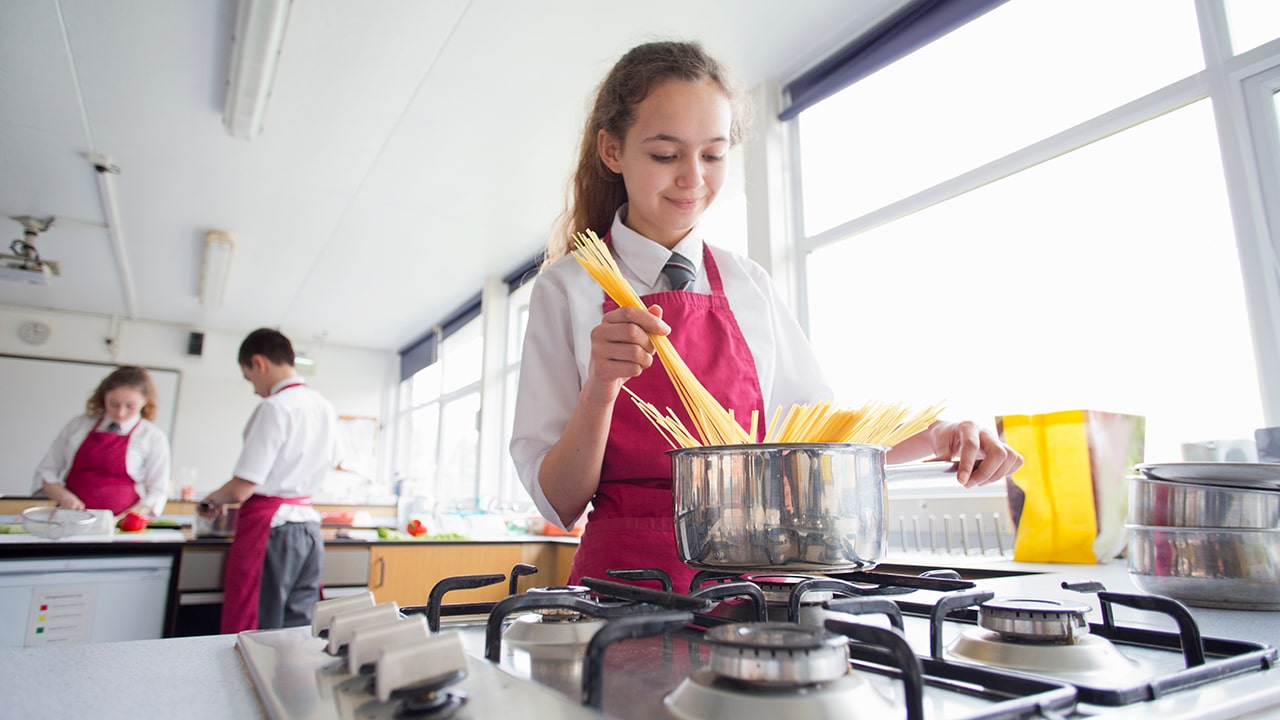 cooking pasta during a cooking class.