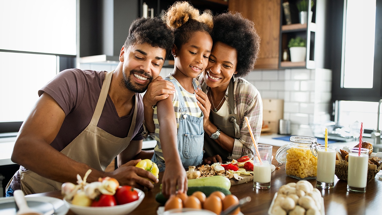 Happy family having fun together at home in the kitchen