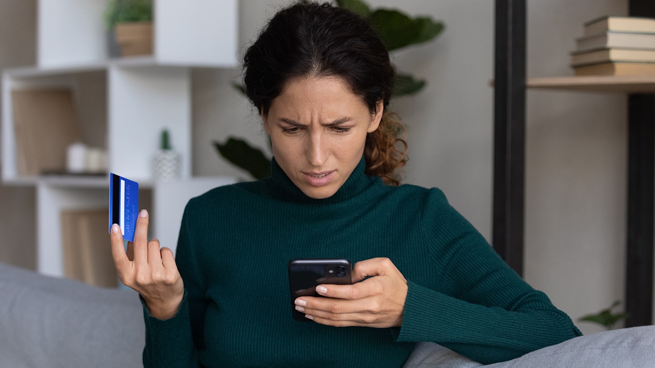 Upset nervous Woman checking billing statement online