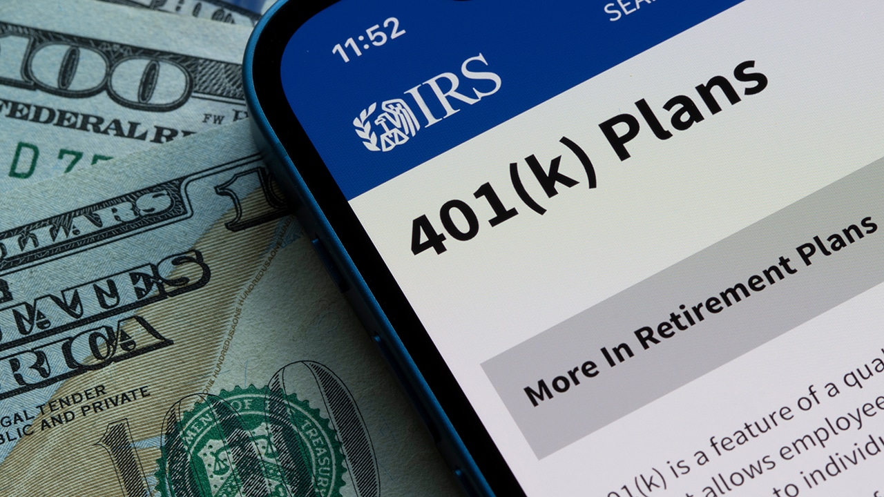 The 401(K) Plans page on the IRS website is seen on an iPhone. 401(k) plans are employer-sponsored defined-contribution pension accounts.