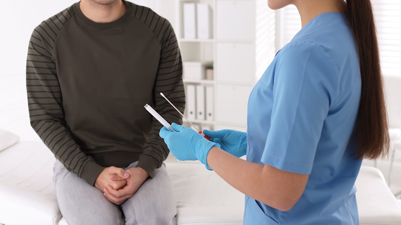 Doctor performing preventive care and a health screening on patient