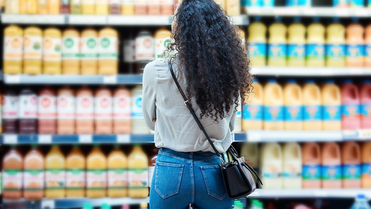 Customer looking at items in grocery store.