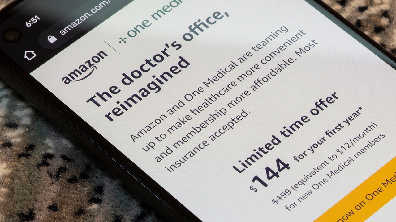 Webpage of One Medical, a virtual and in-office care service that provides preventive care and chronic care management, is seen on the Amazon website on a smartphone.