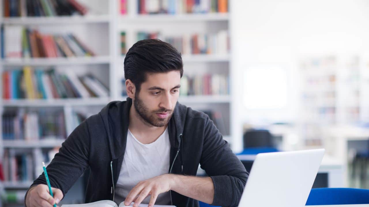 Person studying with books