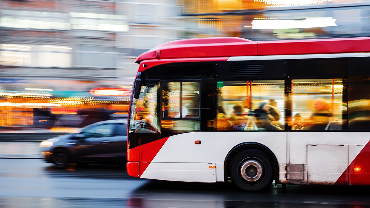 picture of a bus in city traffic in motion blur