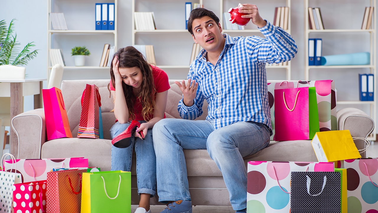 Man looking at all of the things his wife bought wondering why