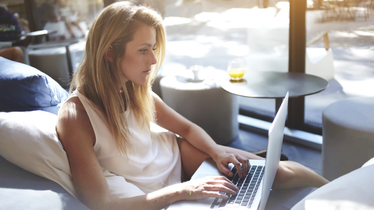 woman writing laptop