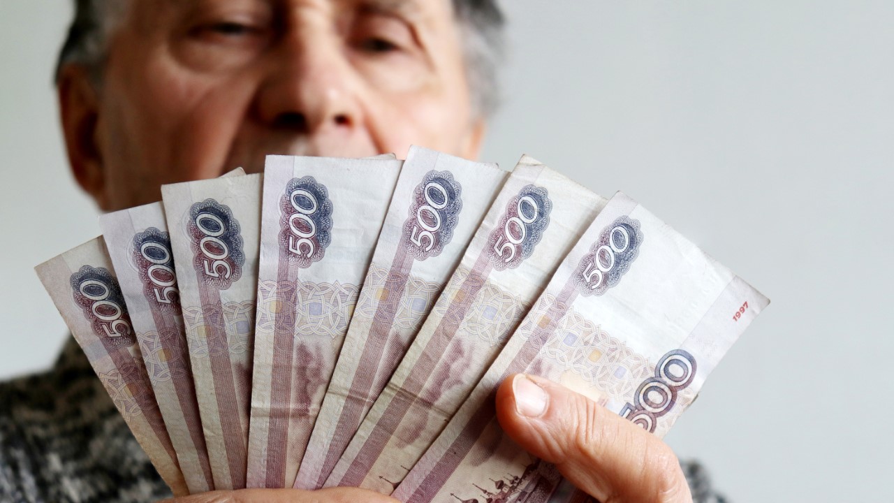 Aged Man Viewing Cash