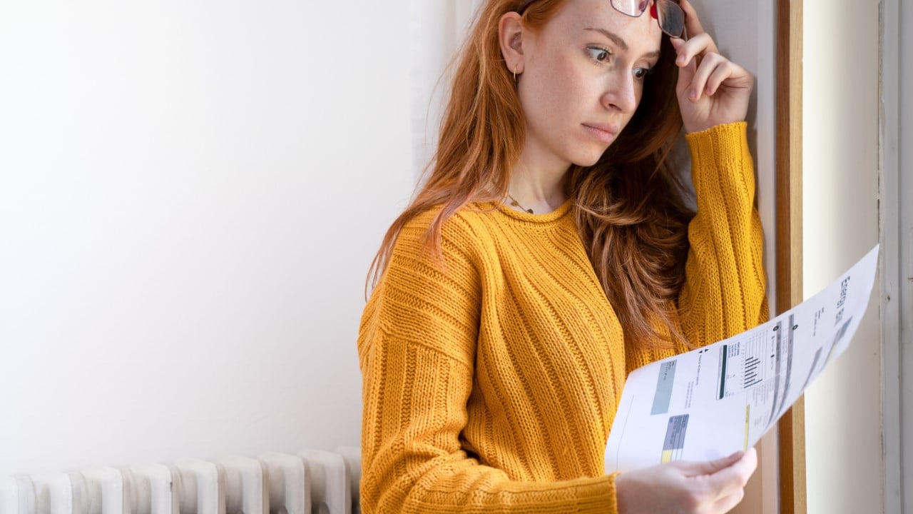 Shocked Woman Viewing Bills