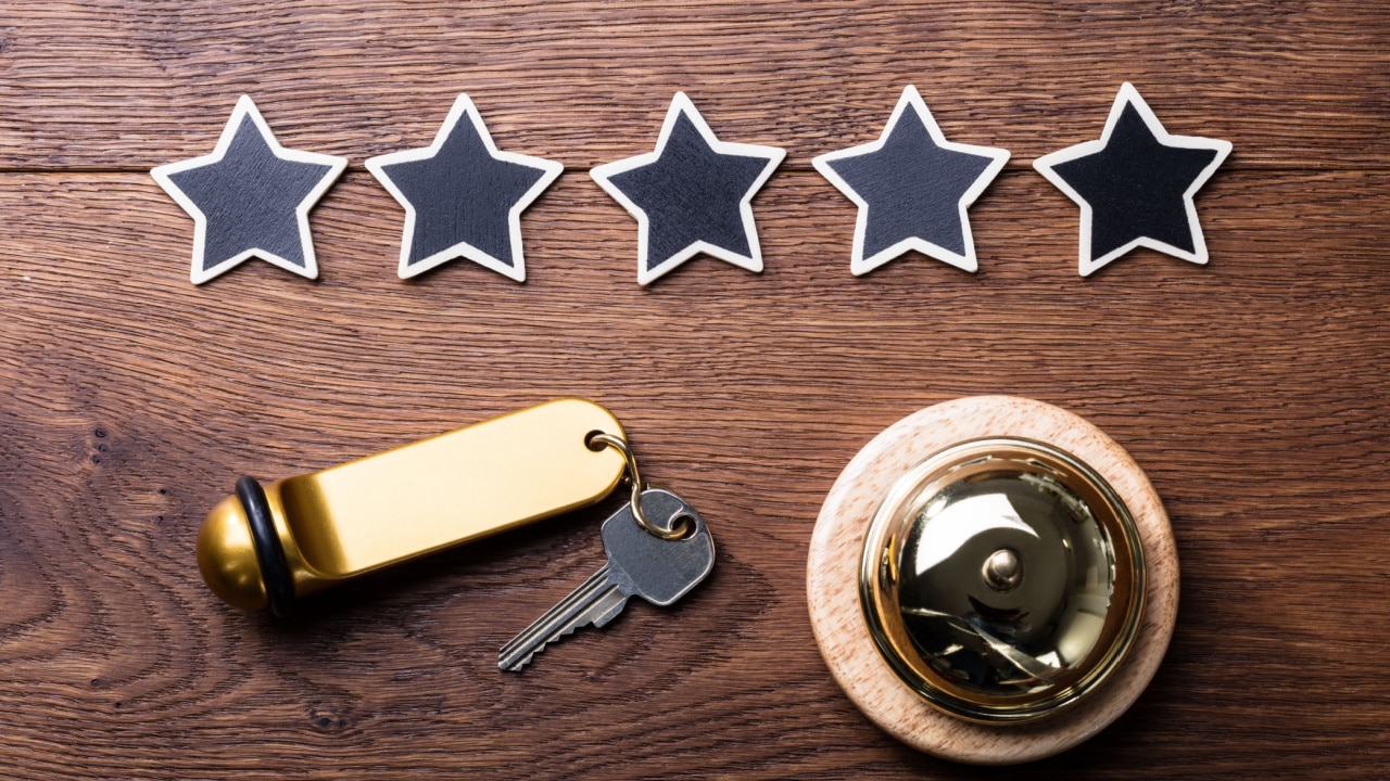 Hotel key and bell with 5 stars rating