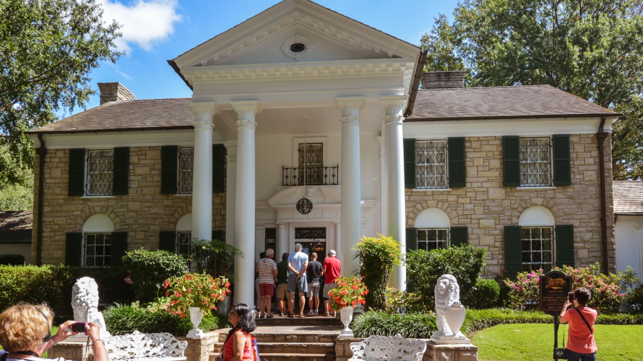 Tourists visit Elvis Presley's Graceland Mansion.