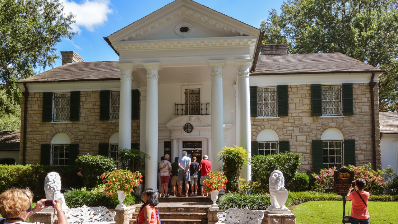 Tourists visit Elvis Presley's Graceland Mansion. 