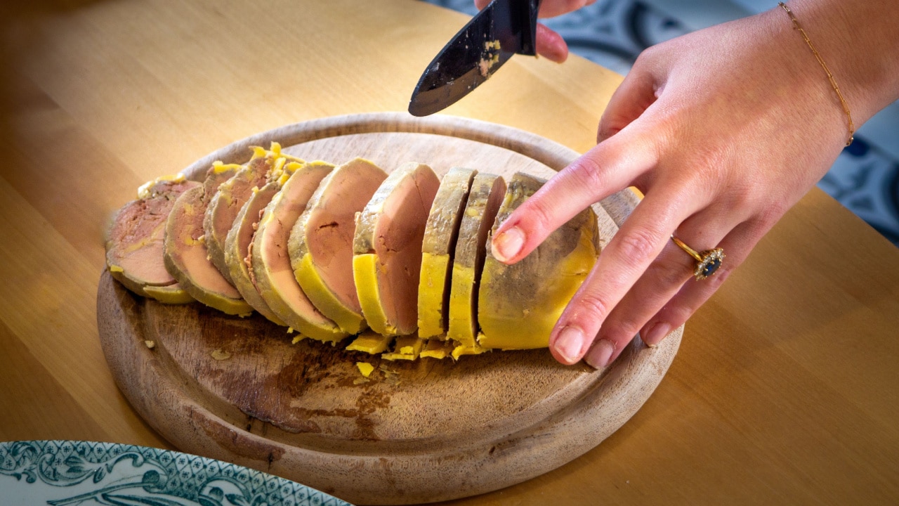 Slicing the delicious fois gras for meal