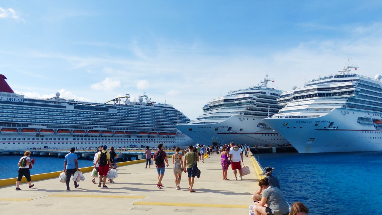 People walking towards cruise ships