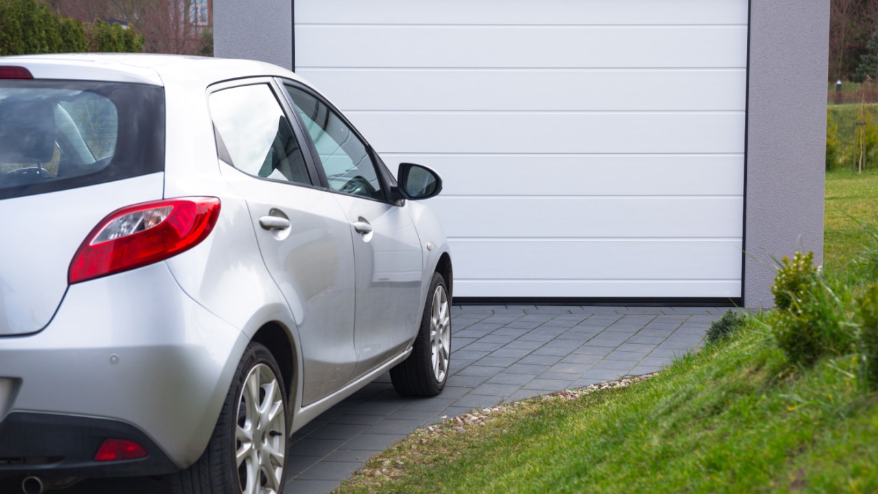 Car parked in rented parking space at personal home