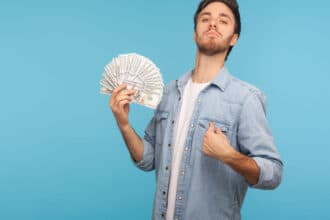 Man holding money he earned