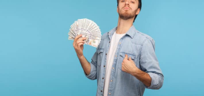 Man holding money he earned