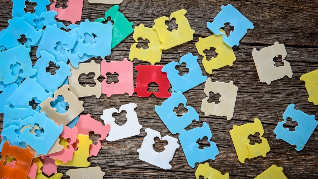 multi-coloured bread clips on a table