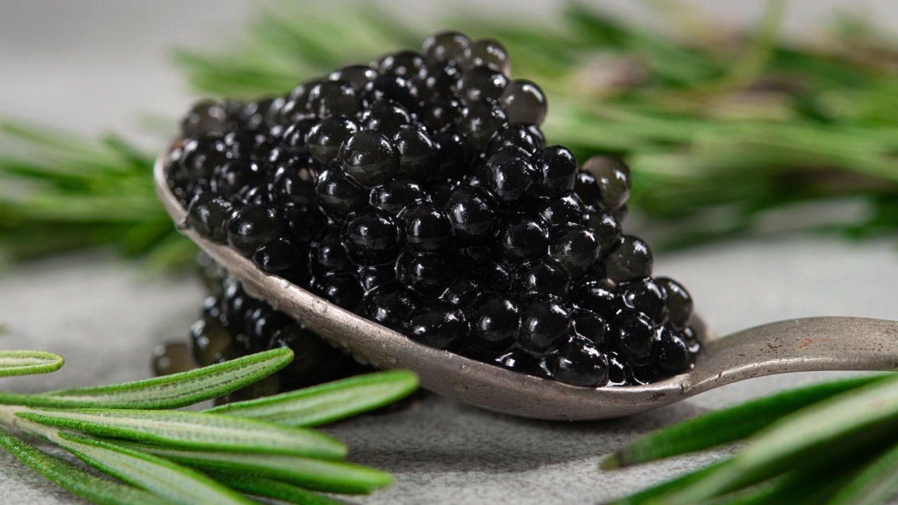 Spoon with black fish caviar