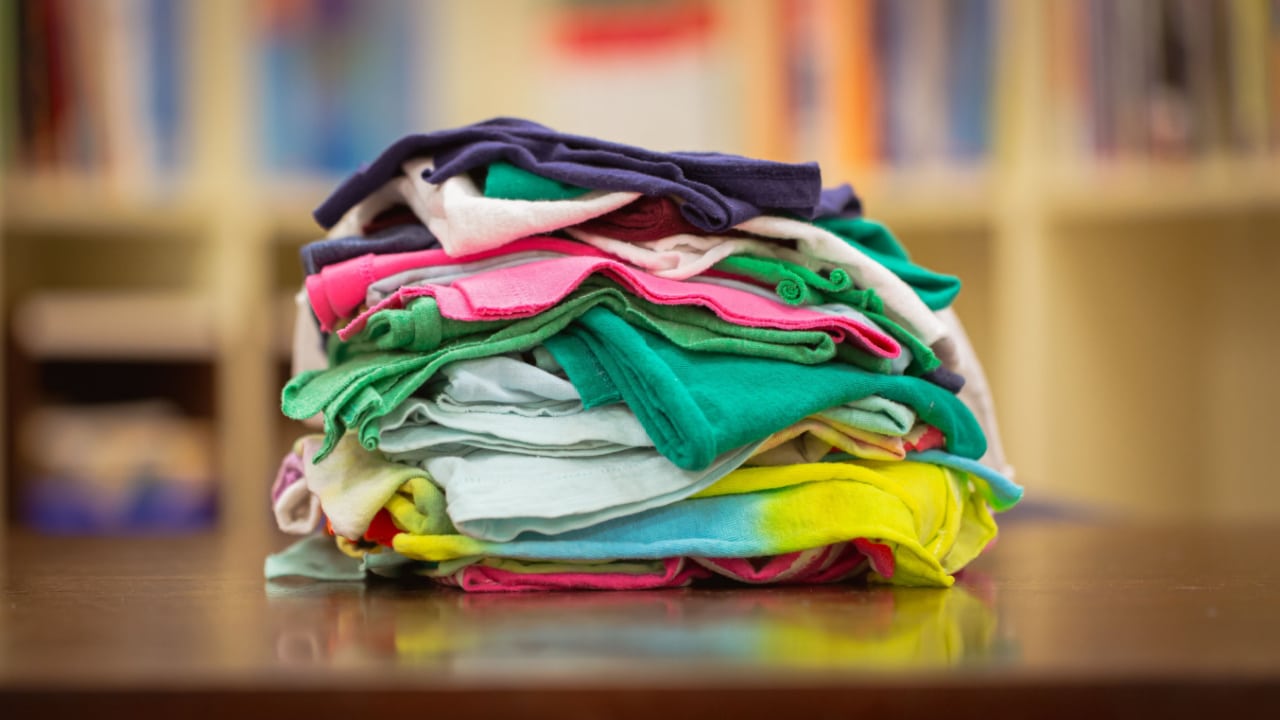 a pile of coloured t-shirt