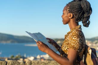 Young tourist woman viewing a map