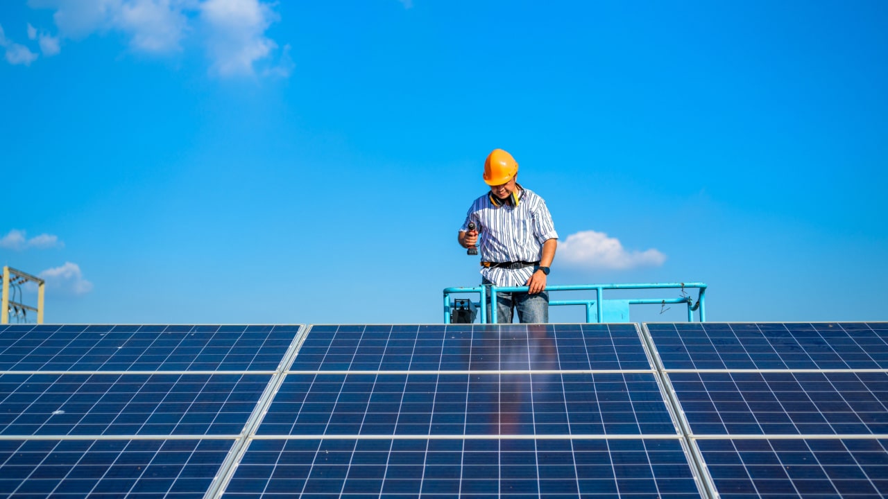 Man installing solar panels