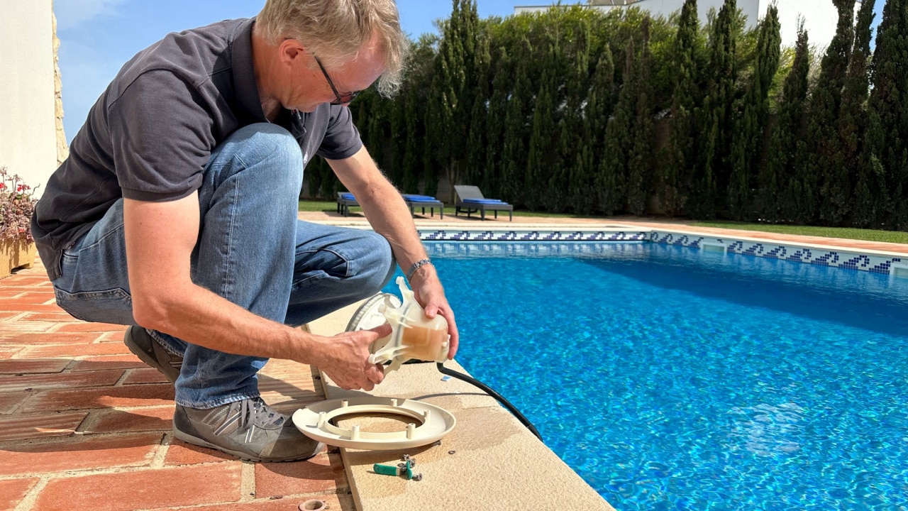 Man servicing a home pool system